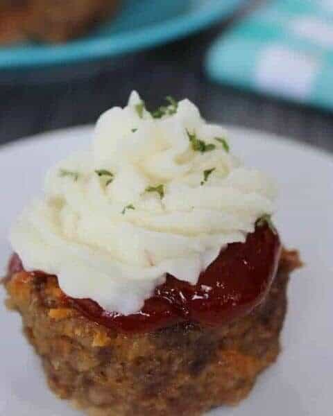 Mini meatloaf cupcakes with mashed potatoes on top.