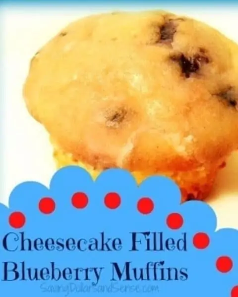 A close up of cheesecake filled blueberry muffin.