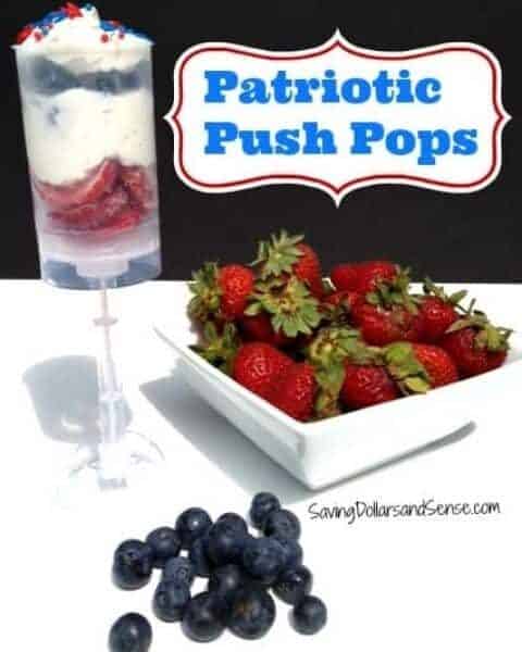Homemade push pops with strawberries, whip cream, and berries.