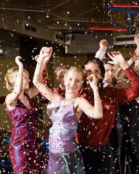 Young women and young men going to prom.