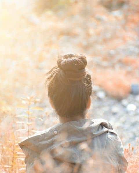 A young girl walking away from the camera.
