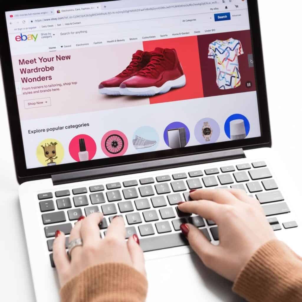 a person using a laptop to shop on ebay.
