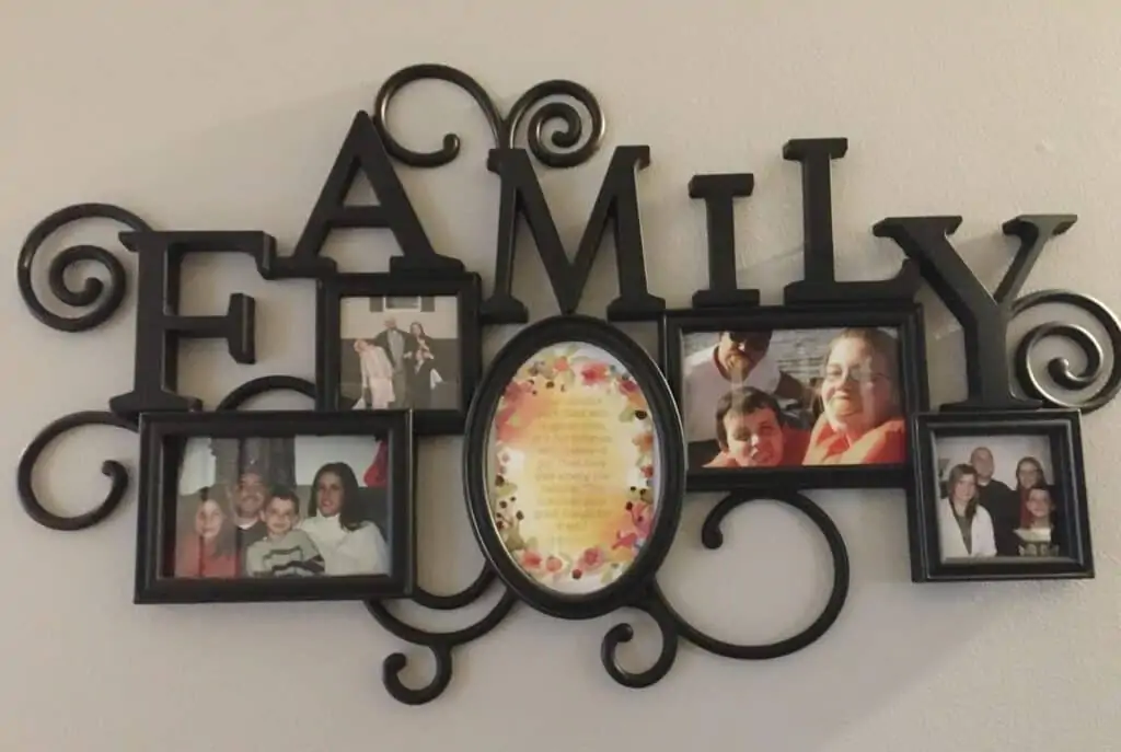 Family with images in frame.