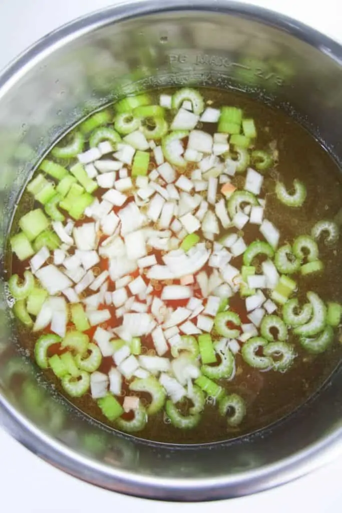 Diced onion, celery and carrots in chicken broth. 