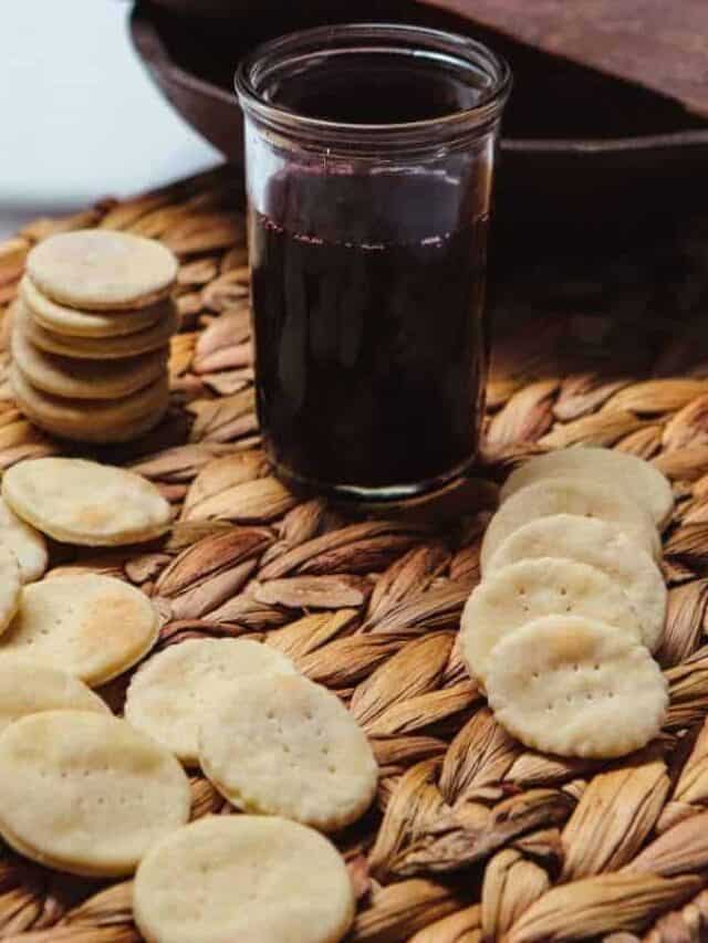 Communion waffers and a glass of communion wine.