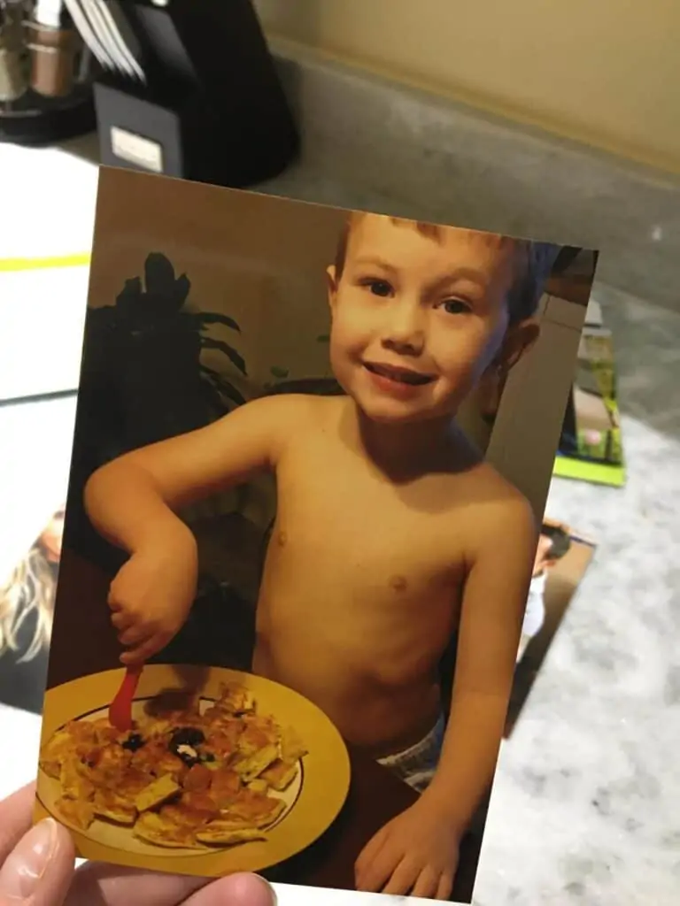 Little boy eating food.