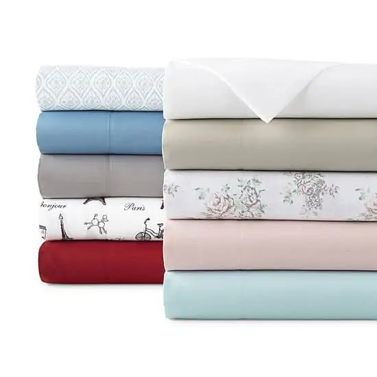 Stack of folded bedsheets;