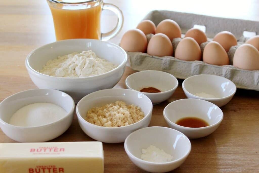 A variety of ingredients including eggs, flour, sugar, apple cider, butter, and more.