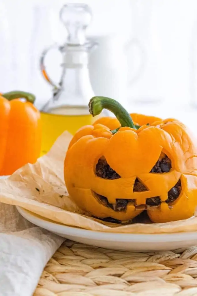 Cooked bell pepper that looks like a jack-o-lantern. 