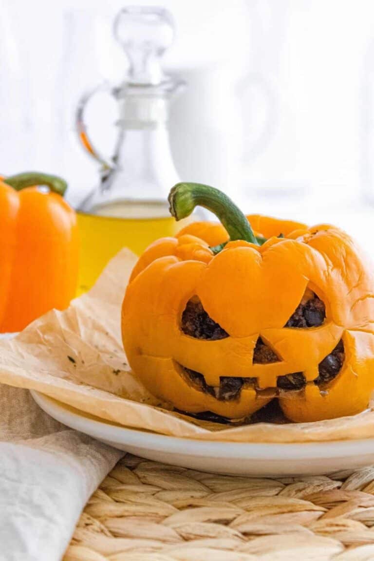 Halloween themed stuffed pepper that's shaped like a pumpkin.