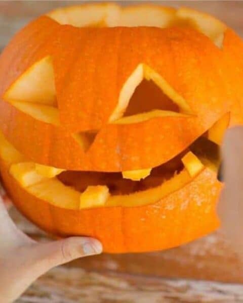 Pumpkin carving and making a jack-o-lantern.