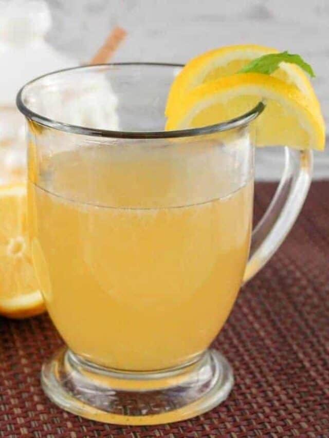 A full glass of copycat Starbucks medicine ball with lemon slices.