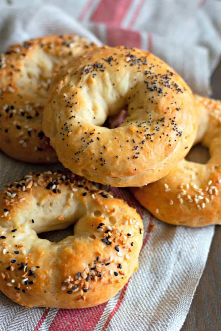 Stack of homemade cooked bagels with everything seeds.