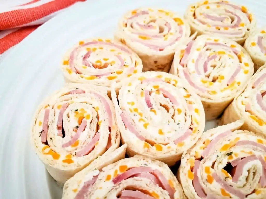 Closeup of ham and cheese pinwheel sandwiches.