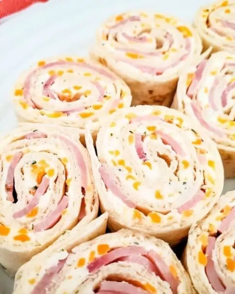 Closeup of ham and cheese pinwheel sandwiches.
