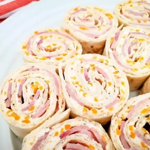 Closeup of ham and cheese pinwheel sandwiches.