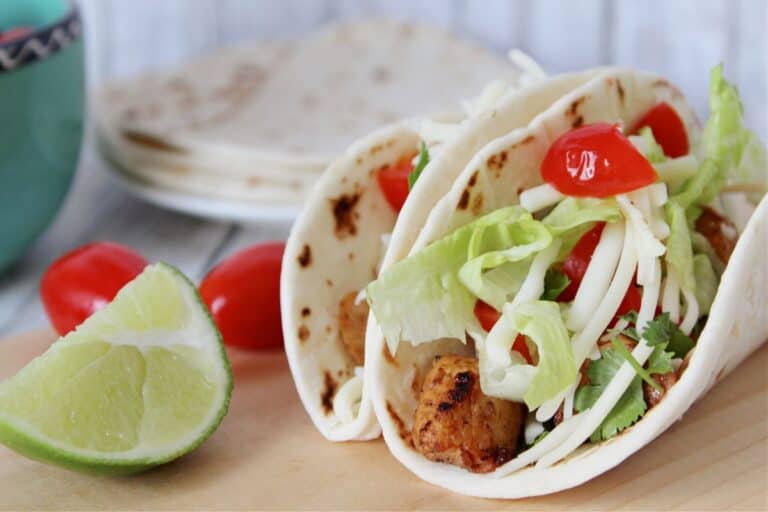 Closeup up crispy chicken tacos.
