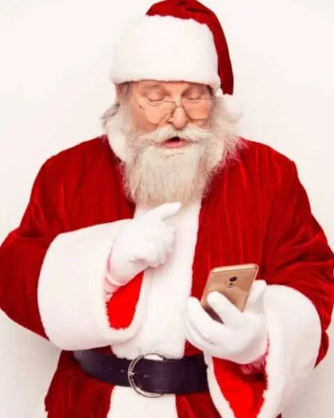 Santa Claus using a smartphone.