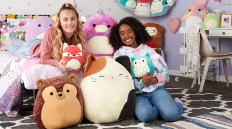 Two girls posing with stuffed animals in their bedroom, pleased with their new $20 free Walmart purchase.
