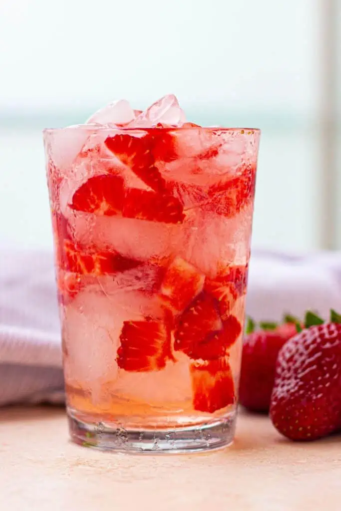 A refreshing Starbucks beverage with strawberries and ice.