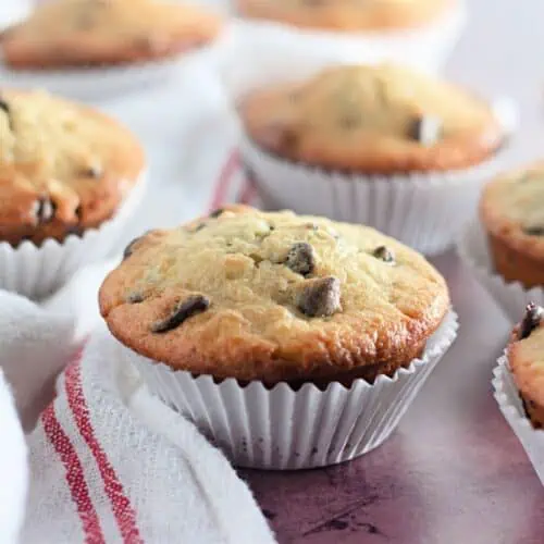 Banana chocolate chip muffins on a napkin.