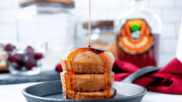 Breakfast stack: Syrup poured over delicious pancakes.