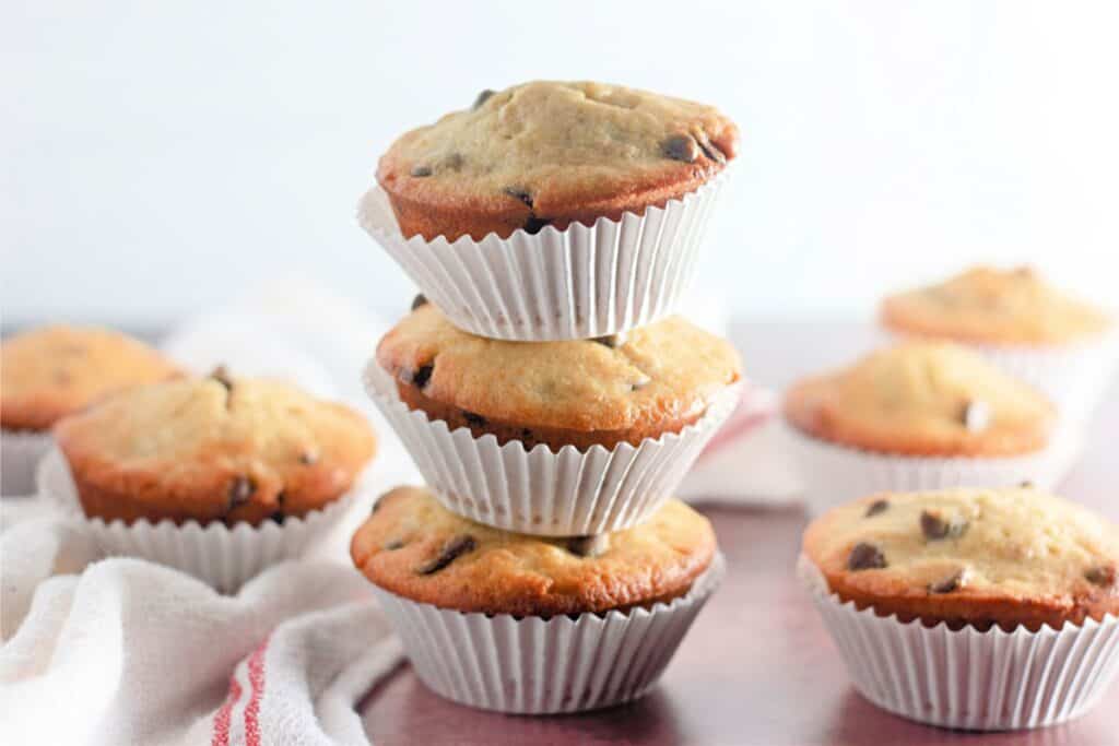 Stacked chocolate chip muffins.