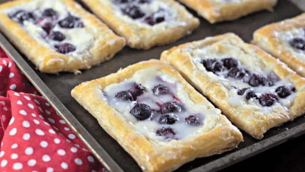 Blueberry tarts with a red polka dot perfect for breakfast ideas.