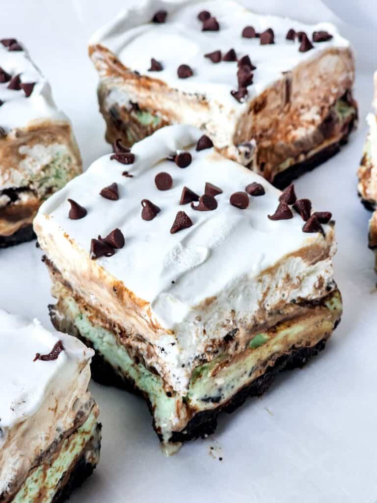 Mint chocolate ice cream sundaes with whipped cream.