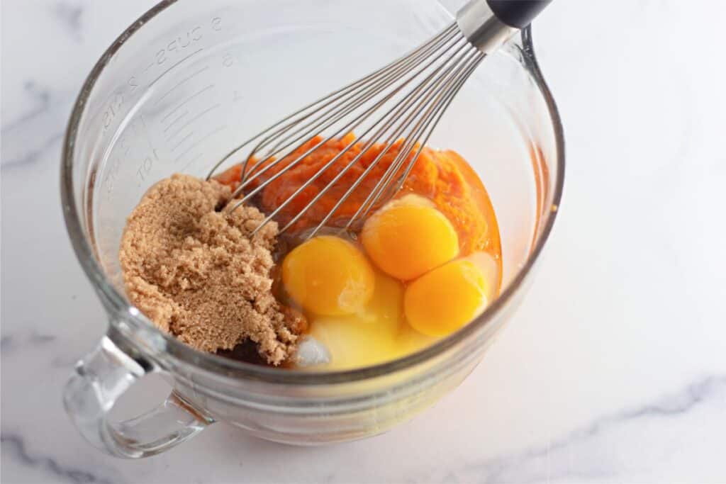 Pumpkin Cobbler enhanced with eggs and sugar blended using a whisk.