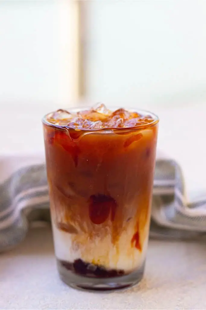 A Starbucks Iced Caramel Macchiato on a table.