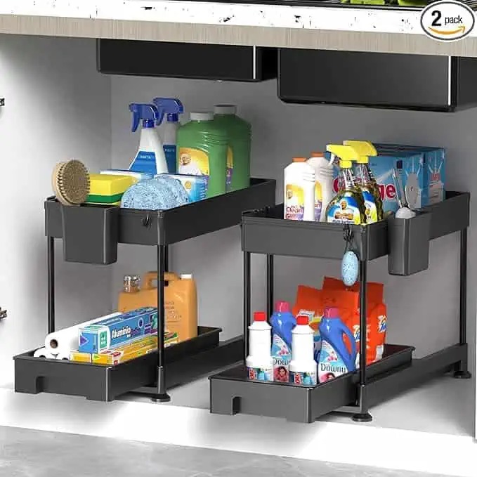 A black kitchen cabinet filled with cleaning supplies.