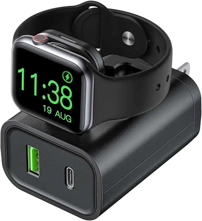 A black apple watch charger with an apple watch on it, available for October 20th Deals.