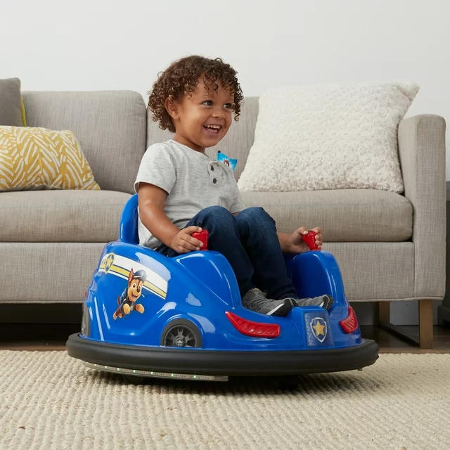 On November 24th, a young boy excitedly sits in a blue car on a rug as he explores the world of imaginative play.