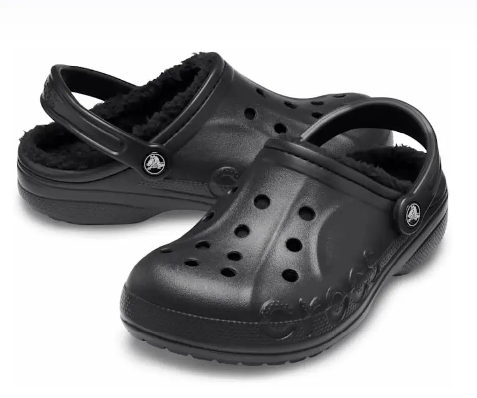 A pair of black crocs clogs on a white background, available for great deals starting November 6th.