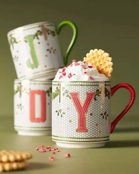 Three mugs topped with cookies and whipped cream on November 24th.