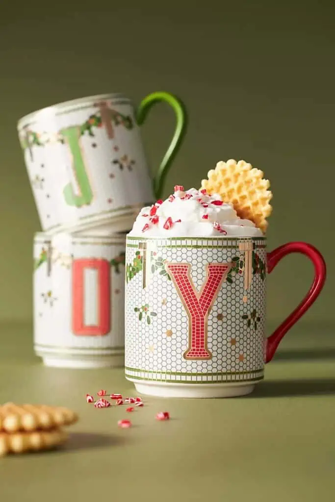 Three mugs topped with cookies and whipped cream on November 24th.
