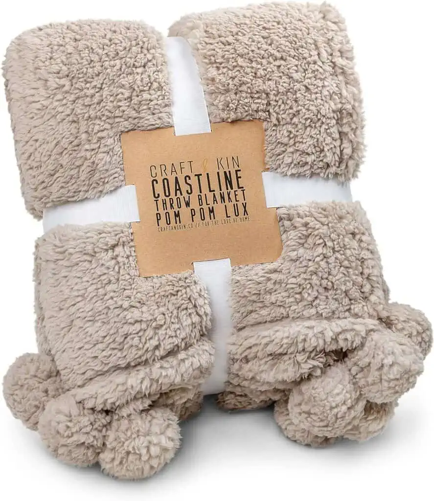 Get ready for cozy nights with our exclusive November 24th deals! Snuggle up with our irresistibly soft beige blanket, adorned with delightful pom poms. Don't miss out on the perfect accessory