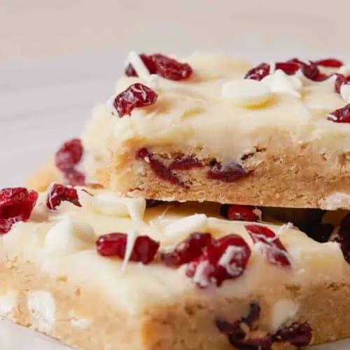 Recipe for irresistible White chocolate cranberry bars inspired by the Cranberry Bliss Bar.