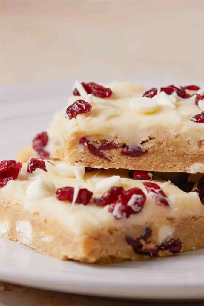 Recipe for irresistible White chocolate cranberry bars inspired by the Cranberry Bliss Bar.