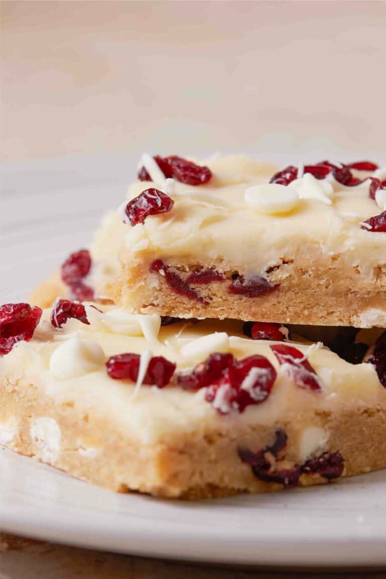 Recipe for irresistible White chocolate cranberry bars inspired by the Cranberry Bliss Bar.