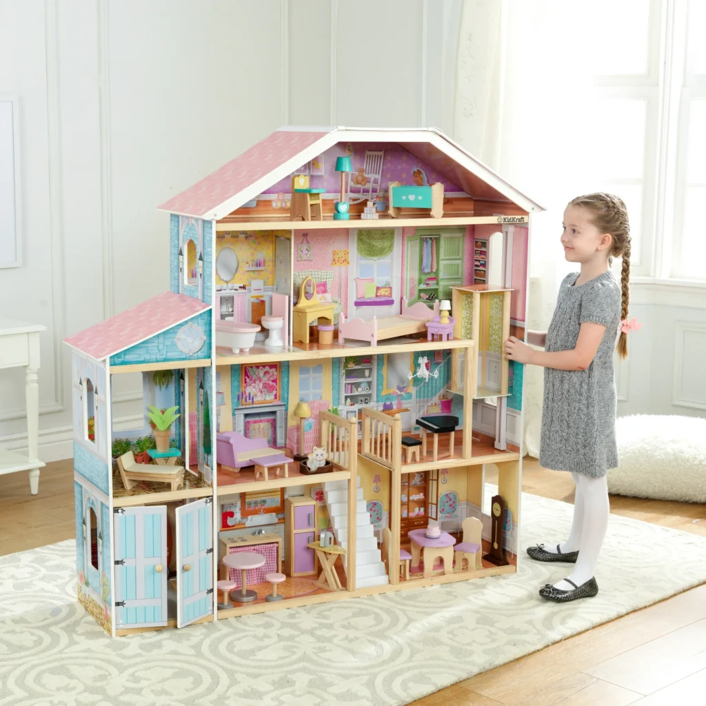 A little girl standing in front of a doll house, exploring the intricate details during the November 27th deals.