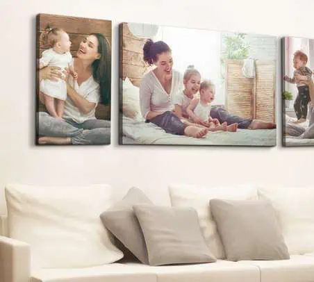 Three canvas prints of a family in a living room available at discounted prices on November 25th.