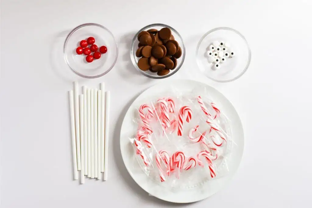 A plate with candy cane sticks and candy canes.