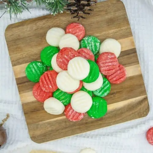 Homemade Christmas cookies on a wooden cutting board.