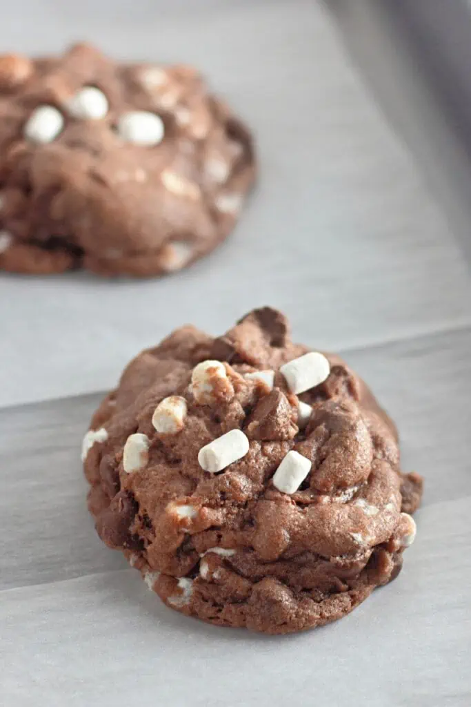 Peppermint hot cocoa s'mores cookies on a baking sheet.