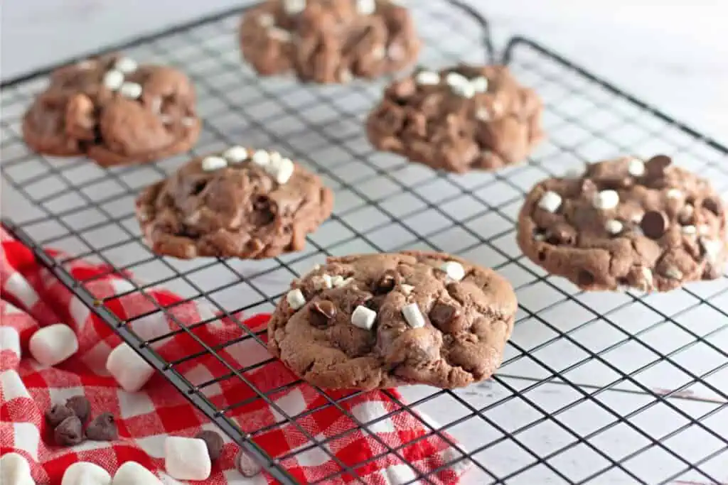 Peppermint hot cocoa s'mores cookies on a cooling rack.