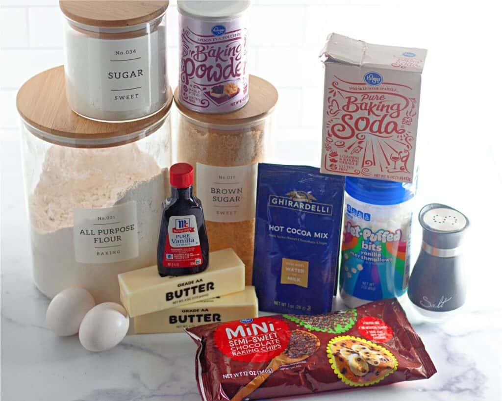 The ingredients for peppermint hot cocoa cookies are on a counter top.
