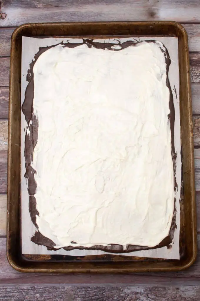 A peppermint bark square on a baking sheet.