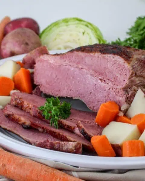 A plate of corned beef and cabbage, cooked in a Dutch Oven.